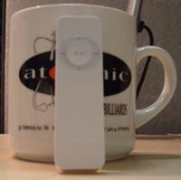 ipod shuffle next to coffee cup